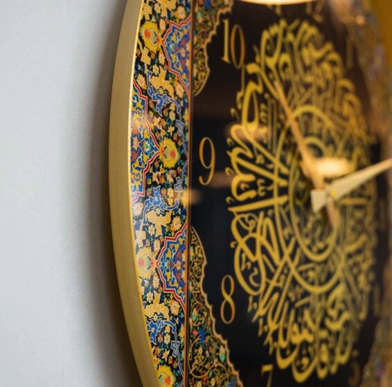 A colorful metal wall clock with Surat Al-Ikhlas written on it - covered with glass - 5