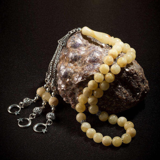 Rosary made of amber drops with Star Moon decorated tassel