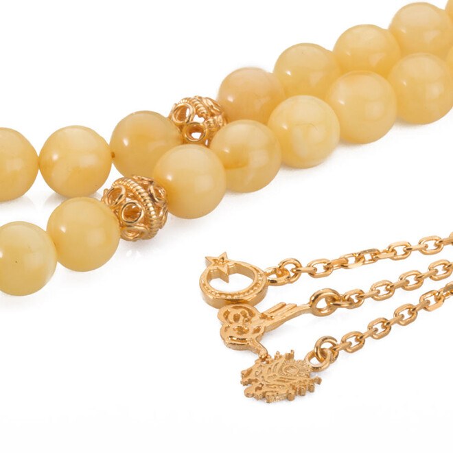 honey colored, wrist-sized rosary made from amber drops