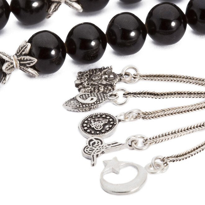 Lignite rosary  with large beads and multi-symbol tassel