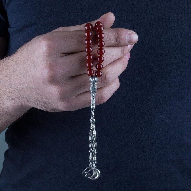 Rosary made of red agate stone with a silver Imame