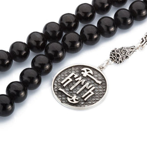 Rosary made of lignite stone with a tassel bearing Turkish GokTurk symbol