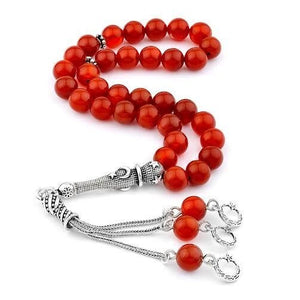 Rosary made of agate stone with a silver tassel bearing the symbol of the moon star
