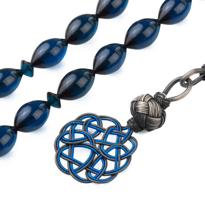 Rosary made of pressed amber with a Qazzazia designed tassel