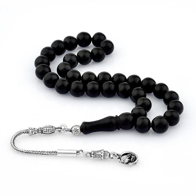 rosary made of lignite stone decorated with a Grey wolf symbol