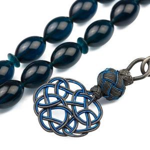 Pressed amber rosary with a Qazzazia tassel