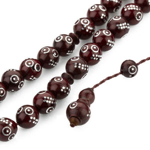 Hand engraved coca rosary with round beads