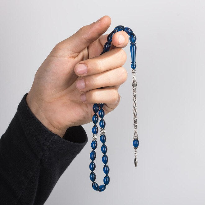 Rosary made of pressed amber with adecorative leaf pattern