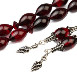 Rosary made of pressed amber in a black-burgundy color