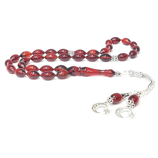 Red rosary made of pressed amber with a double tassel