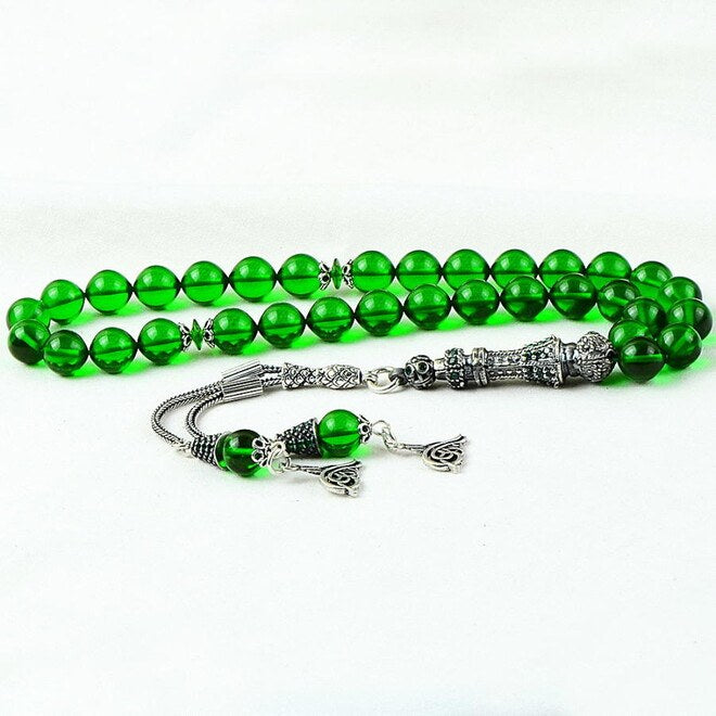 Green rosary made of moire pressed amber