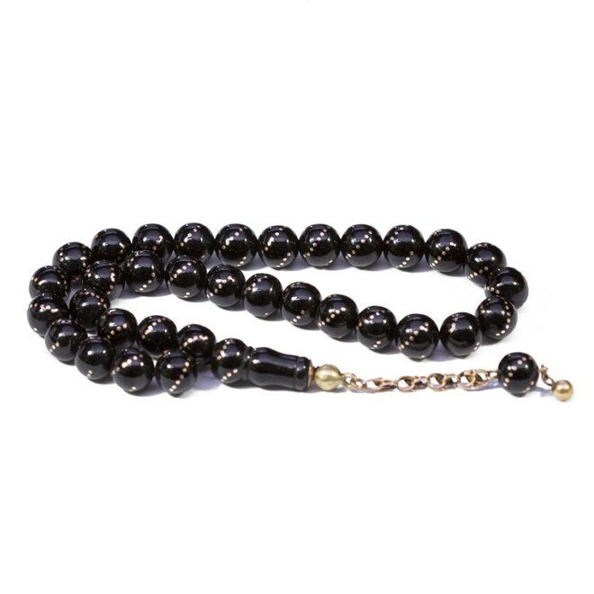 Rosary made of lignite stone engraved with gold