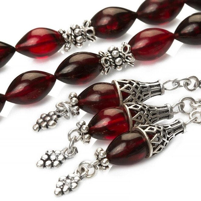 Rosary made of pressed amber decorated with a grape cluster pattern