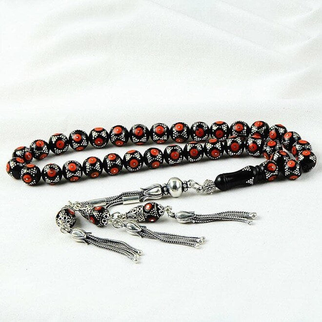 Rosary made of lignite stone embroidered with coral