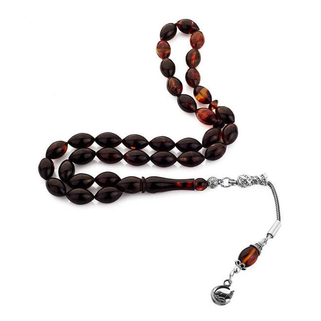 Rosary made of pressed amber with a gray wolf symbol decorated- tassel