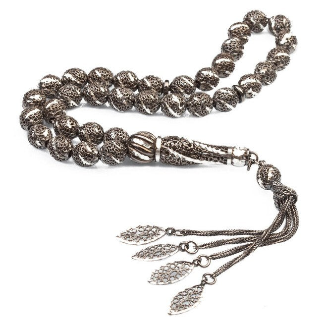 Perforated silver rosary decorated with a silver pen