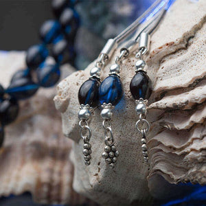 Rosary made of pressed amber with triple tassel bearin grape motif