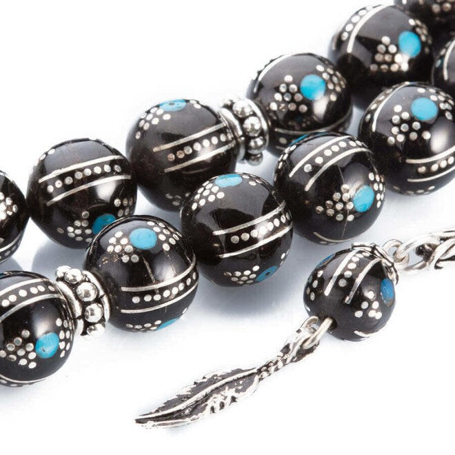 Rosary made of lignite stone with beads embroidered in turquoise