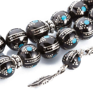 Rosary made of lignite stone with beads embroidered in turquoise