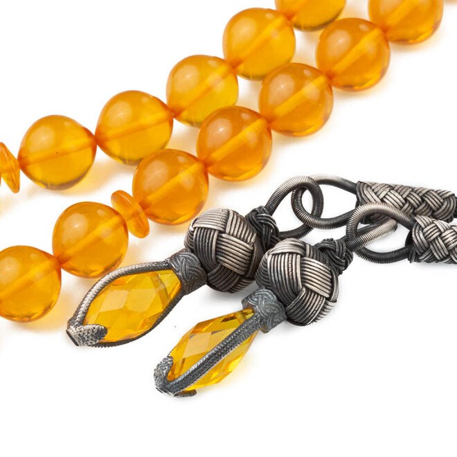 Yellow rosary made of pressed amber with a double tassel