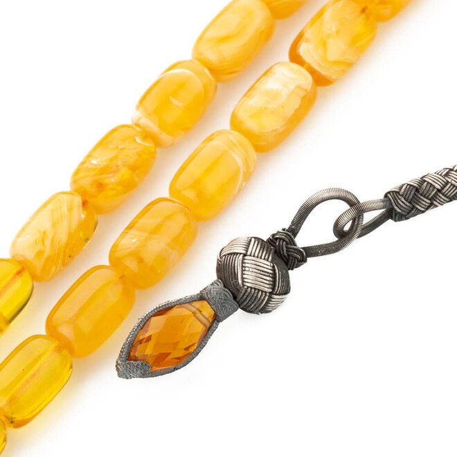 Glass Pressed Amber rosary decorated with intertwining yellow shades