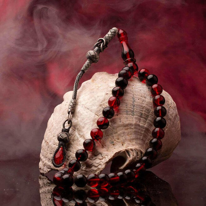 Red Amber Pressed Rosary With a Tassel Having a Glass Piece