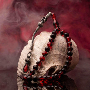 Red Amber Pressed Rosary With a Tassel Having a Glass Piece