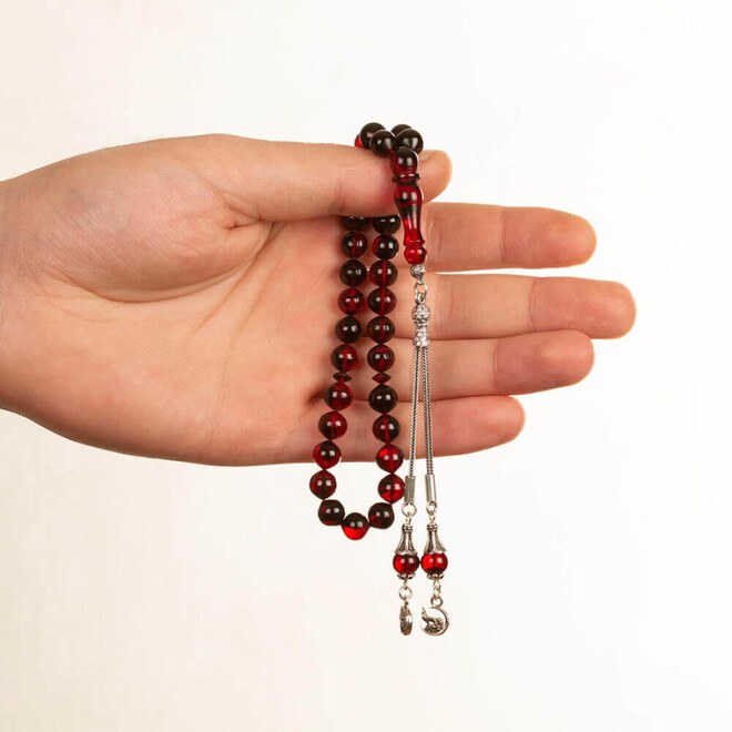 Mixed Red Pressed Amber rosary with two tassels bearing a Gray Wolf symbol - 3