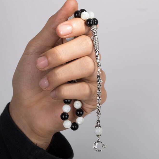 Rosary made of agate and mother of pearl stone in a continuous sequence