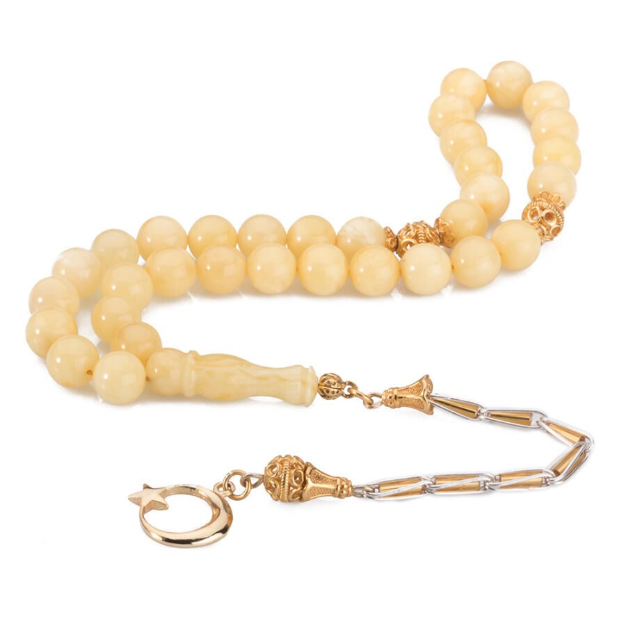 Rosary made of amber with a moon star symbol decorated tassel