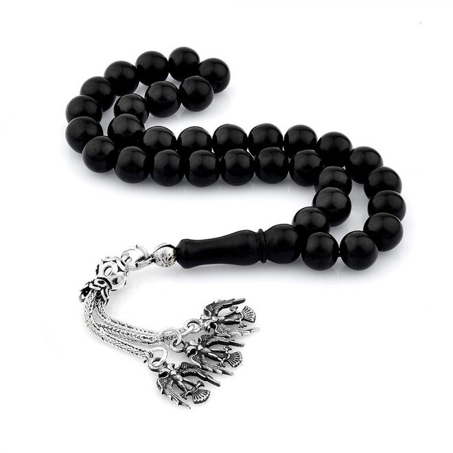 Rosary made of lignite stone decorated with the symbol of the double ...