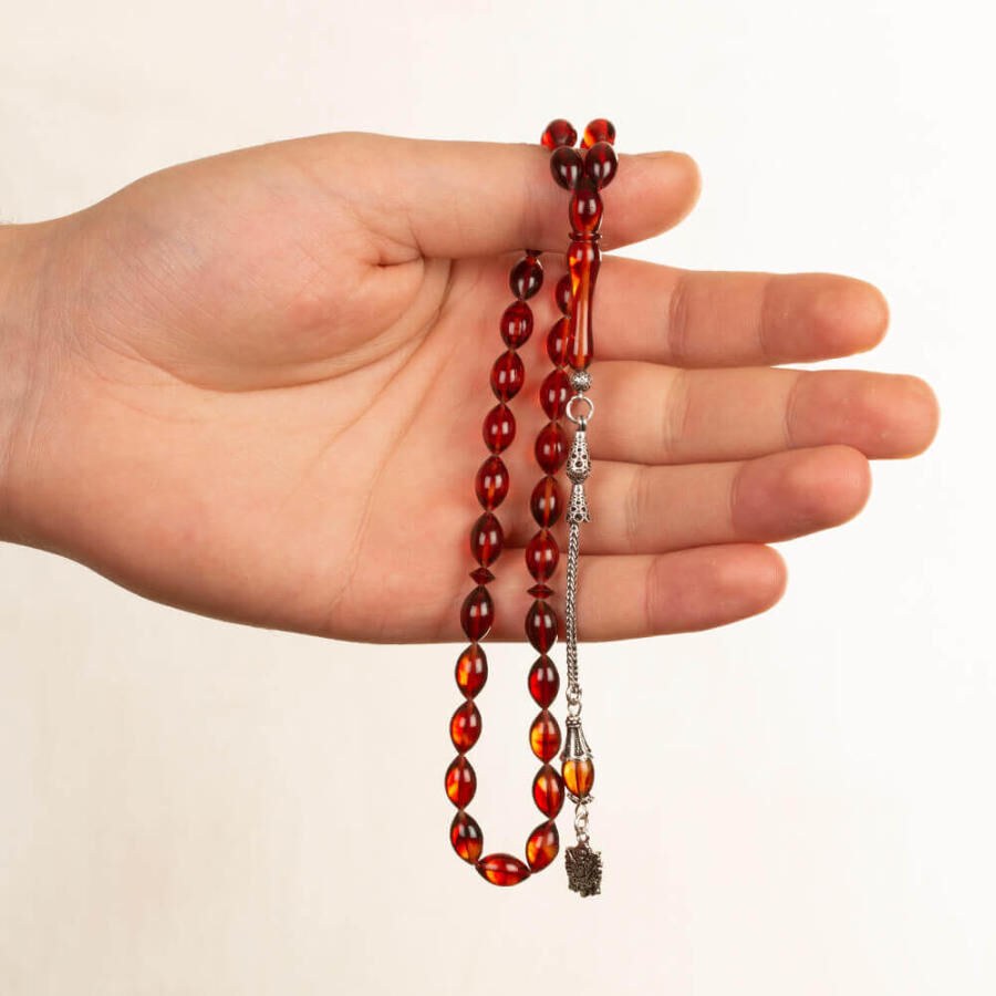 Rosary made of pressed amber with a tassel bearing the symbol of an Ottoman Coat - 2