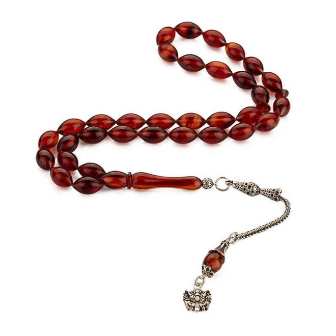 Rosary made of pressed amber with a tassel bearing the symbol of an Ottoman Coat - 4