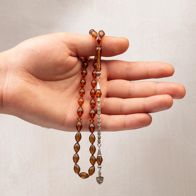 Rosary made of pressed amber with tassel bearing moon star symbol - 2